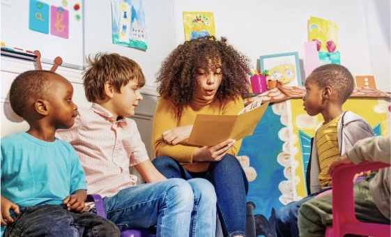 Woman reading to children